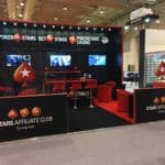 Poker Stars black and red exhibition stand with wall mounted screens